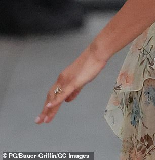 Zendaya (last name Coleman) was wearing a simple gold band on her left-ring finger beside the $500K Jessica McCormack-designed engagement ring she debuted in January 2025