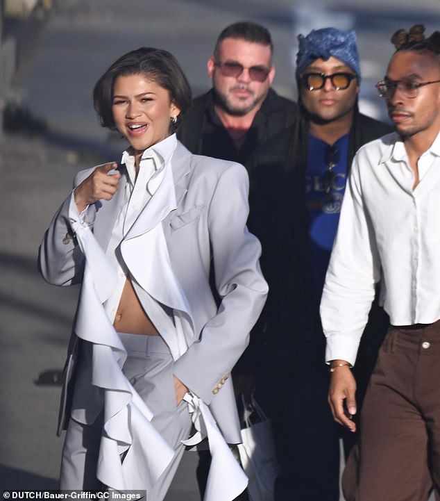 Zendaya's glam squad trailed behind her including her trusted stylist Law Roach (2-R), who told Access Hollywood on March 1 that 'the wedding already happened.'