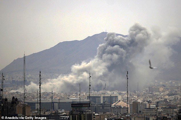 Mr Trump has warned NATO it faces a 'very bad' future if they don't help the US. Pictured: Smoke rises after an aistrike on Tehran