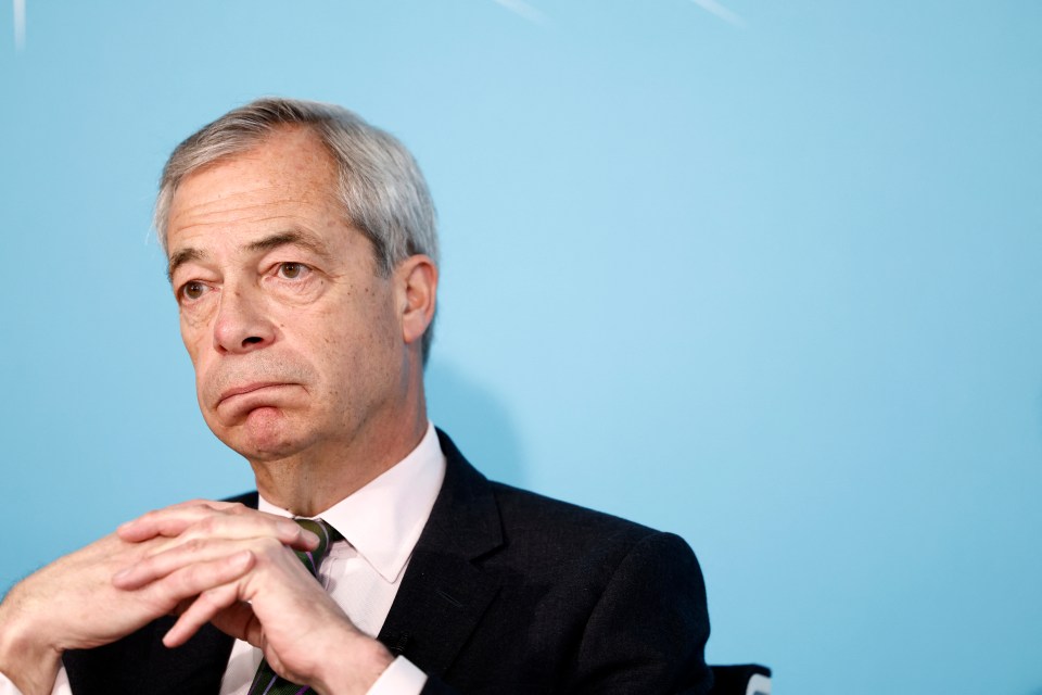 Nigel Farage, leader of Reform UK, looking pensive during a press conference.