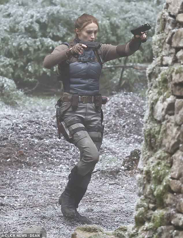 Sophie looked incredible as she shot intense and physically demanding scenes in the woodland area before reaching a stone building tucked away between the trees