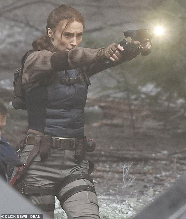The star looked intense as she filmed the action scenes in a woodland in Surrey