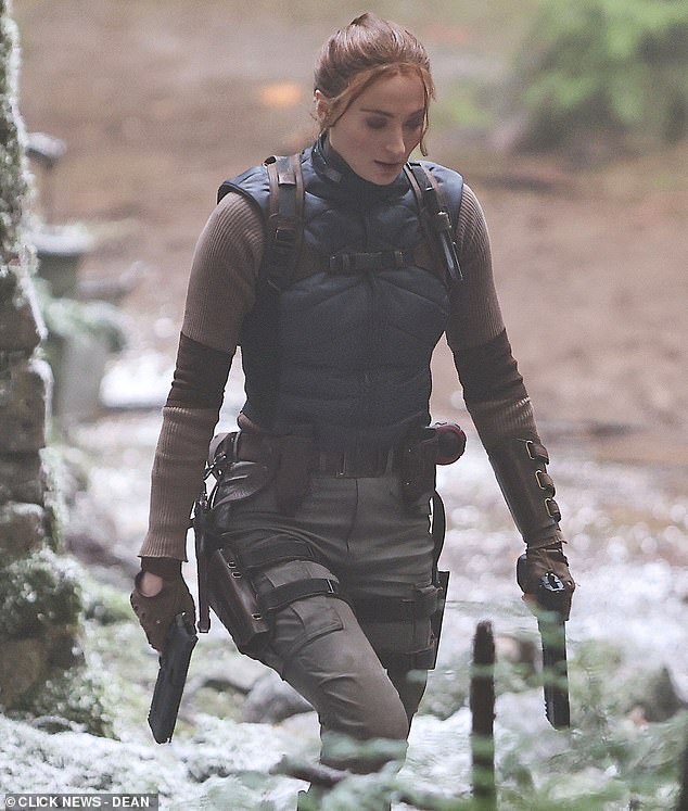 The British star completed the costume with black knee high boots with a knife tucked into the top of them and a small backpack