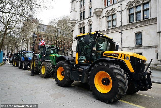 Tractors line up outside the Royal Courts of Justice ahead of a Judicial Review into the Chancellor's inhieritance tax raid on family farms and firms