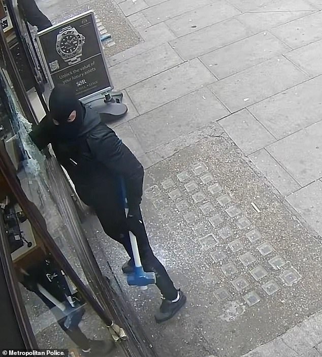 They broke through the glass and reached through to grab handfuls of watches and jewellery