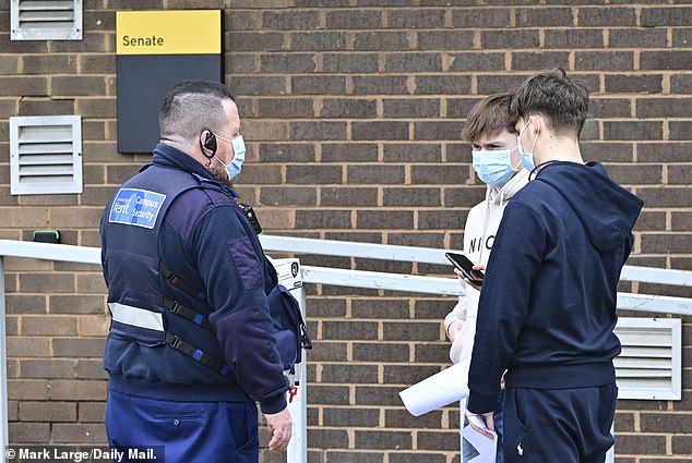 Scenes outside the University of Kent in Canterbury today as students queue for antibiotics