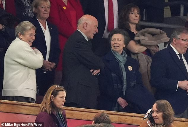 In response to the sweet clip, royal fans have taken to X in their masses to praise Anne for being 'so human and brilliant'. At Dublin's Aviva Stadium, Anne wrapped up warm in a navy wool, double breasted coat and tartan scarf (pictured)
