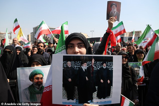 Large crowds gather at Enghelab Square in Iran's capital Tehran during the ceremony