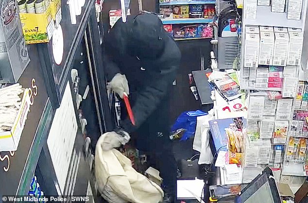 He tried to attack a member of staff at the small business before starting to ransack the shelves (pictured) for their most valuable items