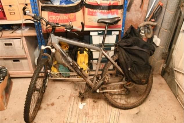 CCTV footage, from a neighbour's security camera in the minster town of Southwell, Nottinghamshire, then showed Brooks returning home after the attack, before opening his garage to put away his bicycle (pictured)