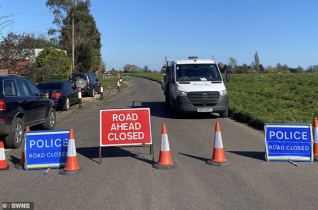 The vehicle veered off the road and into the River Nene in Wisbech St Mary, Cambridgeshire, at around 8.20pm on Tuesday night. Picture from the scene