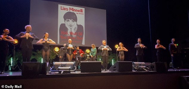 Dancers surround Minnelli after a rousing dance performance of the song New York, New York at her book event at the Million Dollar Theater on Tuesday