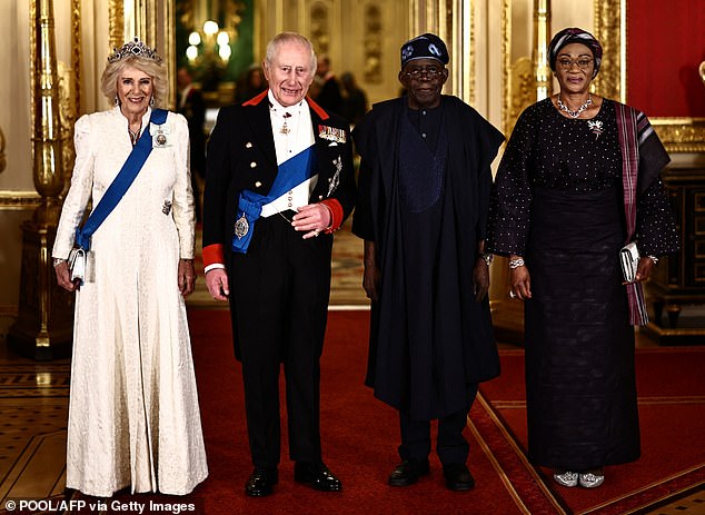 King Charles III, Queen Camilla (L), Nigeria's President Bola Tinubu and Nigeria's First Lady Oluremi Tinubu (R) arrive to attend the banquet