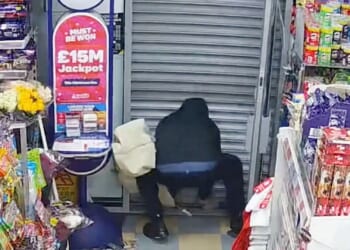 Moment knifeman pleads 'get me out of here' & desperately tries to lift up shutter after he's trapped inside news agents