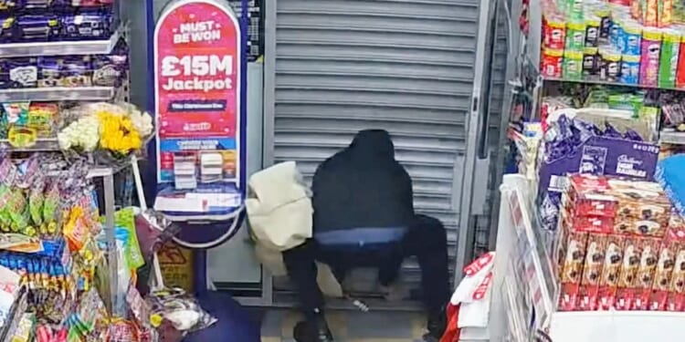 Moment knifeman pleads 'get me out of here' & desperately tries to lift up shutter after he's trapped inside news agents