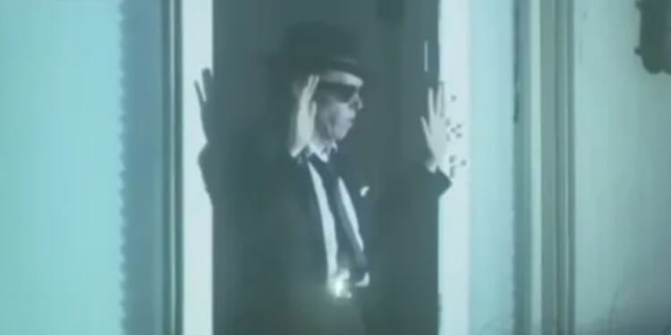 Trans woman dressed like a Blues Brother 'murders millionaire property developer' before hours long stand off with cops