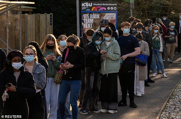 People queue to receive vaccinations at the Sports centre at the University of Kent on Wednesday, following an outbreak of meningitis cases in the area