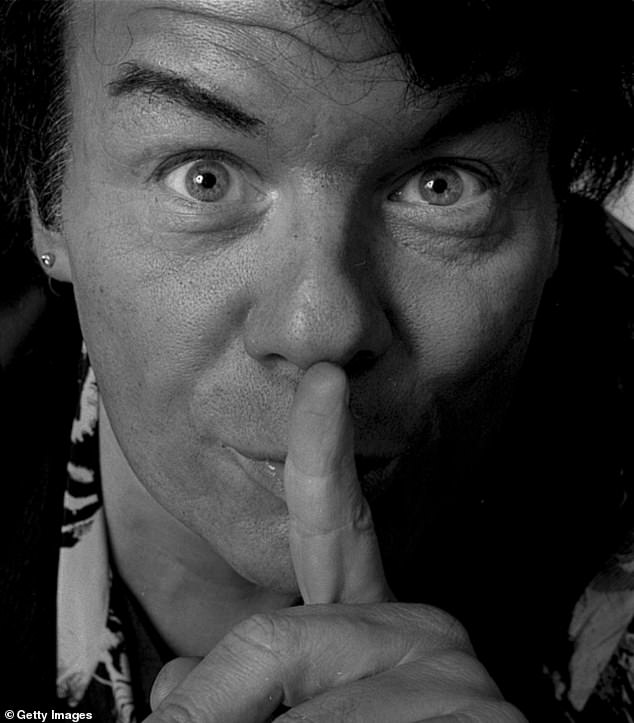 The 81-year-old, whose real name is Paul Gadd, is said to be wheelchair-bound and almost totally deaf. Pictured above in the 1990s