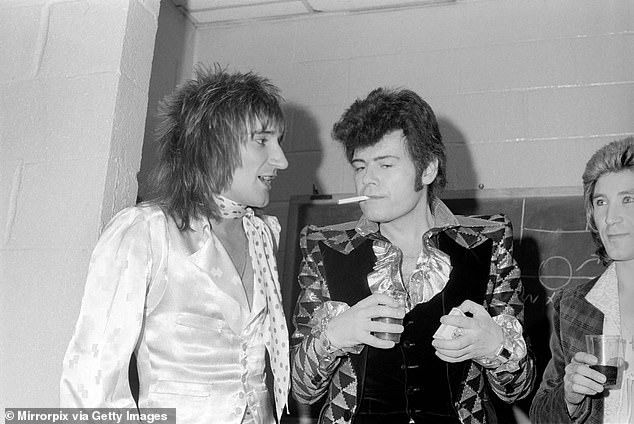 Despite his frailty, he remains on an 'enhanced' prison regime, giving him access to a television, phone calls and a weekly allowance for the canteen. Pictured with Rod Stewart in 1975