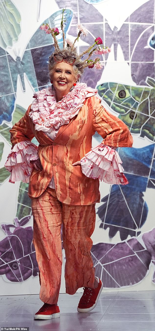 Prue Leith, 86, has fun on the catwalk in a pink ruffle shirt and orange suit for eco-designers Vin + Omi last month