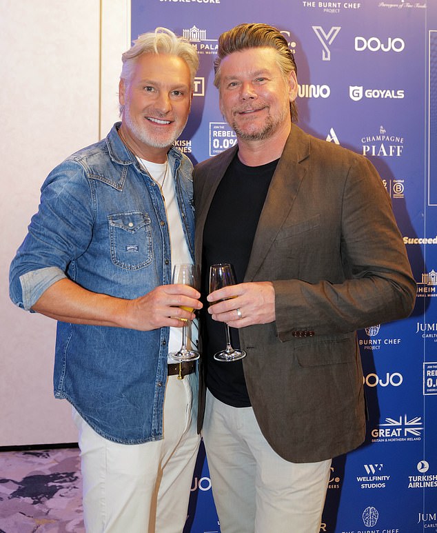 Other guests in attendance at the central London event included celebrity makeup artist Gary Cockerill (L) and his husband, Phil Turner (R)
