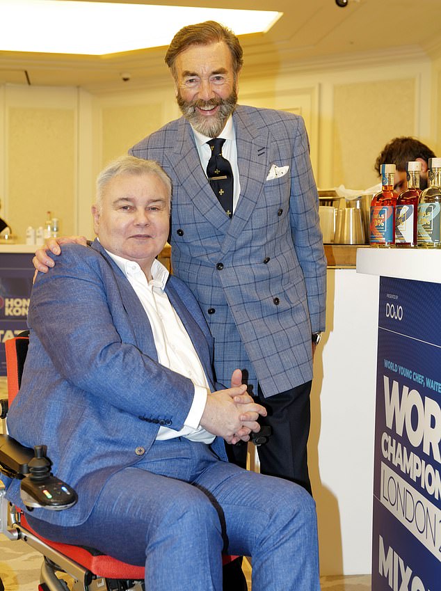 The veteran presenter posed for a photo alongside Robert Walton MBE while serving as judge