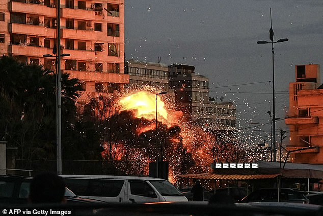 A fireball rises from the site of an Israeli airstrike that targeted a building in Beirut's Bashoura neighborhood early on March 18