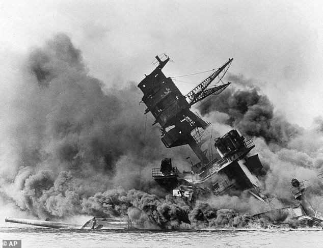 The USS Arizona sinks during the Japanese attack on Pearl Harbor on December 7, 1941. Japan's surprise attack against an American naval base brought the US into World War II