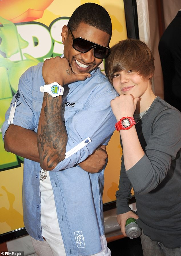Usher and Scooter Braun engineered Bieber's rise to fame, signing him to their label after winning a bidding war against Justin Timberlake; Usher and Bieber pictured 2009