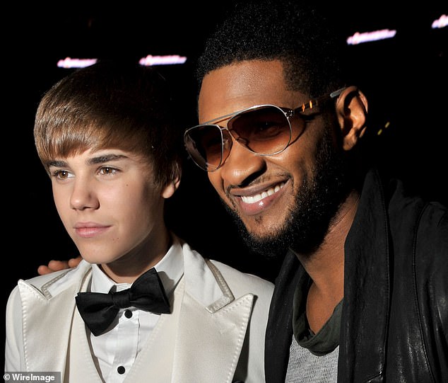 'I definitely try to be as much of a big brother, mentor and protector as I can,' Usher said on the French radio show Le 6/9 in 2010; he and Bieber are pictured at the 2011 Grammy Awards