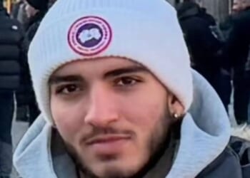 Teen who died after being stabbed in neck on upmarket street is pictured as man, 31, charged with murder