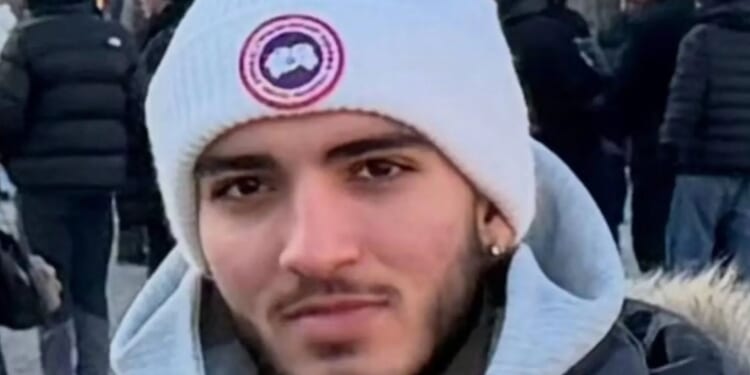 Teen who died after being stabbed in neck on upmarket street is pictured as man, 31, charged with murder