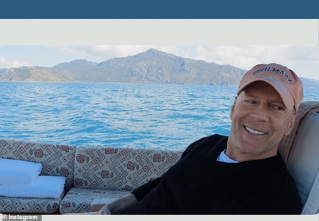 Heming shared a photo of Willis flashing a big smile as he relaxed by the water during a scenic getaway