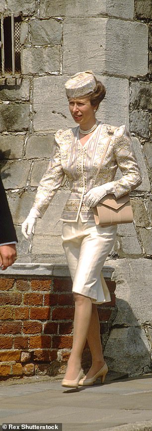 Anne selected a pale printed skirt suit, worn first at Royal Ascot in 1988. A Maureen Baker number, it was topped with a pillbox hat with net trim, and paired with nude shoulder bag and court shoes (pictur
