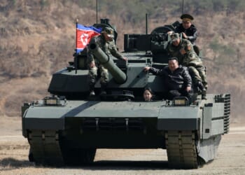 Grinning Kim Jong-un lets mini-me daughter drive TANK in matching leathers as he grooms teen to take on tyrannical reign