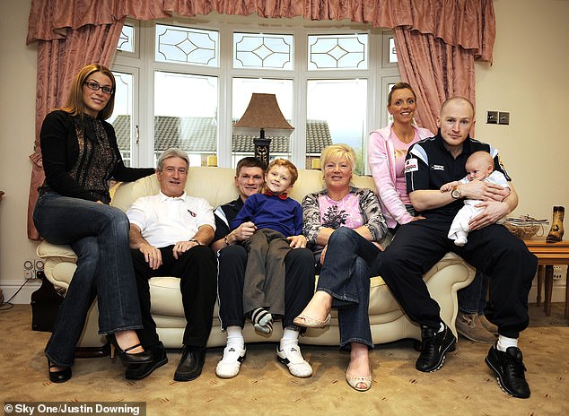 A family photograph from the Sky programme 'At Home With The Hattons' shows (from left) Hatton's partner Jennifer Dooley, father Ray, Hatton with his son Campbell, his mother Carol, brother Matthew's girlfriend Jenna and brother Matthew holding his son Jack in 2008