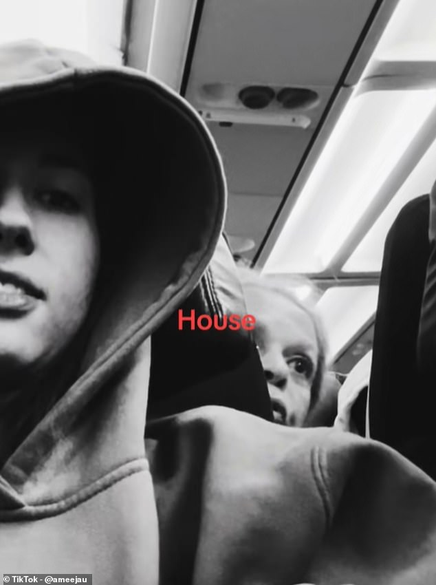 The woman, who was seated behind Ameera, can be seen violently shoving the seat multiple times