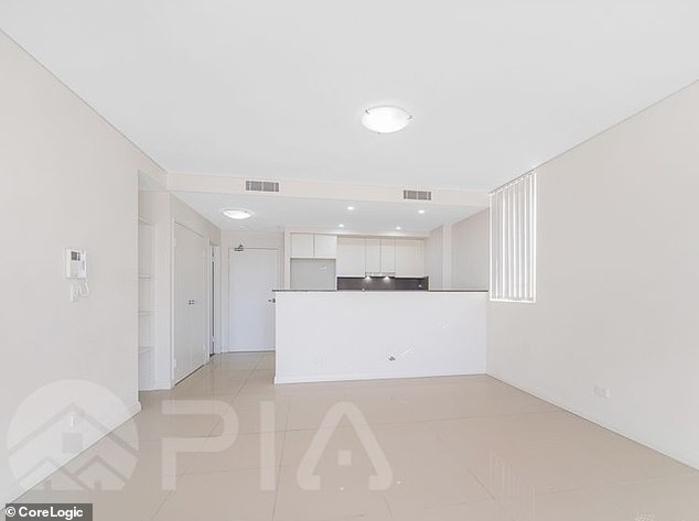 An online advertisement states the unit features 'open-plan living spaces designed for relaxation, with spacious balconies that enhance natural light and airflow'