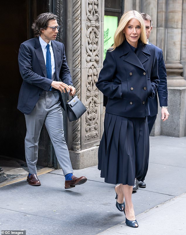 Falchuk kindly carried Paltrow's handbag for her later on at the celebration while she kept her hands buried in the pockets of her stylish jacket