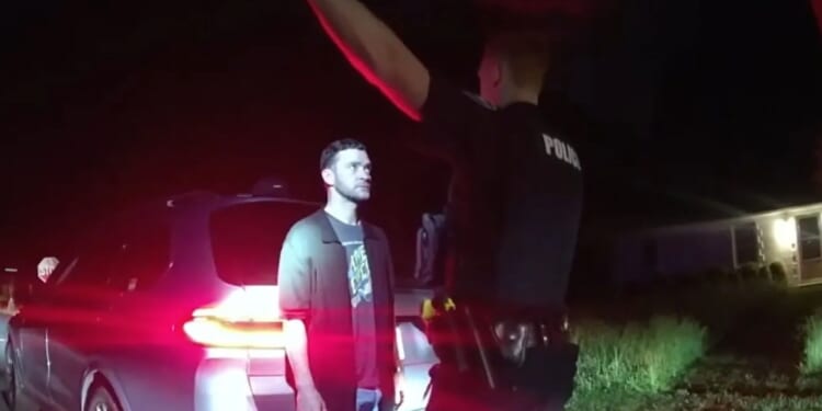 Moment Justin Timberlake is cuffed after singer fails sobriety tests during drink driving arrest as body cam released