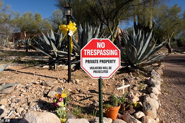 A 'no trespassing' sign was posted at the home of Nancy Guthrie amid a growing memorial in Tucson