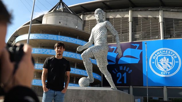 Silva visits his statue outside the Etihad back in 2022. He has been immortalised alongside Sergio Aguero and Vincent Kompany, and will soon be joined by Kevin De Bruyne