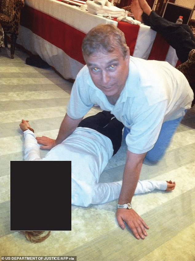 Pictured: Andrew kneeling over an unidentified woman in an image that appears in the Epstein Files