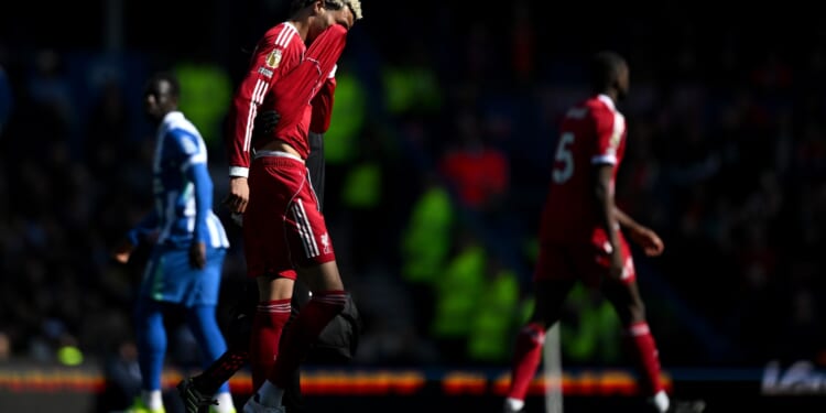 Liverpool suffer major injury blow as star forward forced off moments after delayed kick-off at Brighton