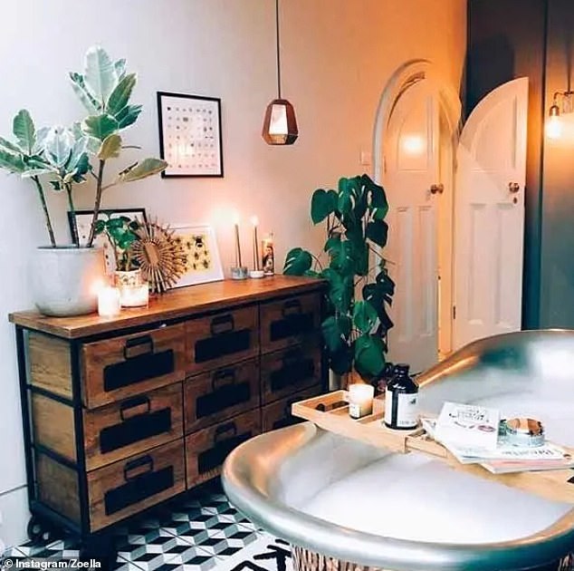 Deviating from the trends, Zoella's bathroom boasts a copper-bottom roll-top bath and is finished with graphic tiles
