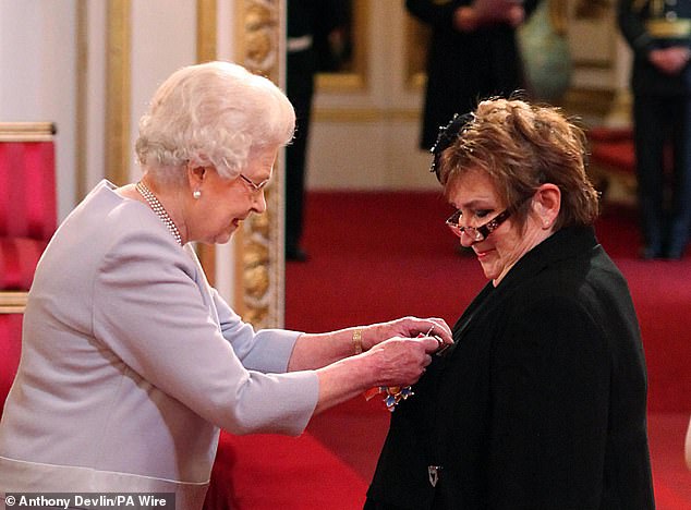 Jenni Murray is made a Dame Commander by the Queen at Buckingham Palace in 2011