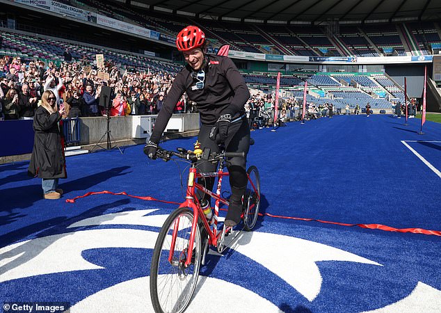 The Radio 1 Breakfast DJ, 40, cycled for eight days on a tandem bicycle, and was surprised by family and friends along the way, including Prince William