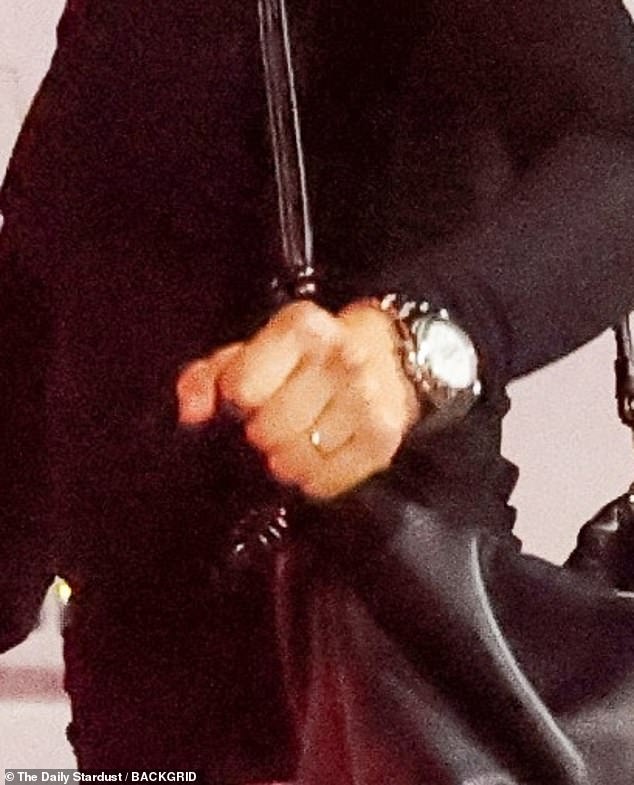 The actress appeared to be wearing only a gold band on her left-ring finger, adding fuel to buzz that they're already hitched