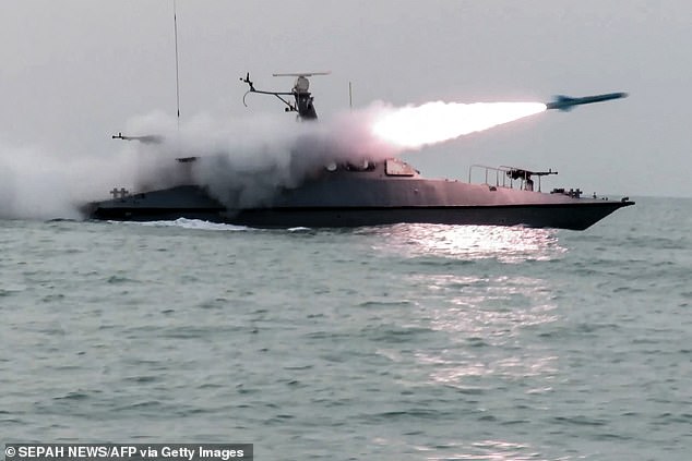 A boat firing a missile during a military exercise by members of the IRGC and navy in the Gulf
