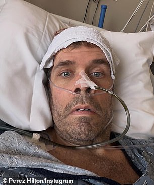 Hilton shared a series of selfies while resting in a hospital bed and also donned a blue-patterned hospital gown